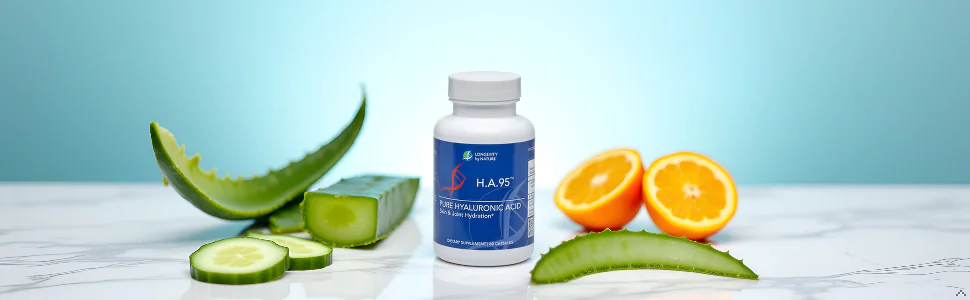 Longevity by Nature H.A.95 Pure Hyaluronic Acid supplement bottle surrounded by fresh aloe vera leaves, cucumber slices, and citrus halves on a marble surface.