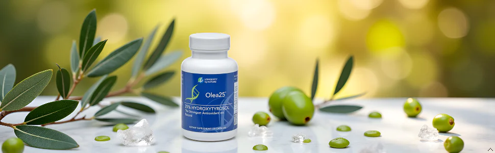 Longevity by Nature Olea25 25% Hydroxytyrosol dietary supplement bottle surrounded by fresh olive branches, olives, and crystal accents on a marble surface.
